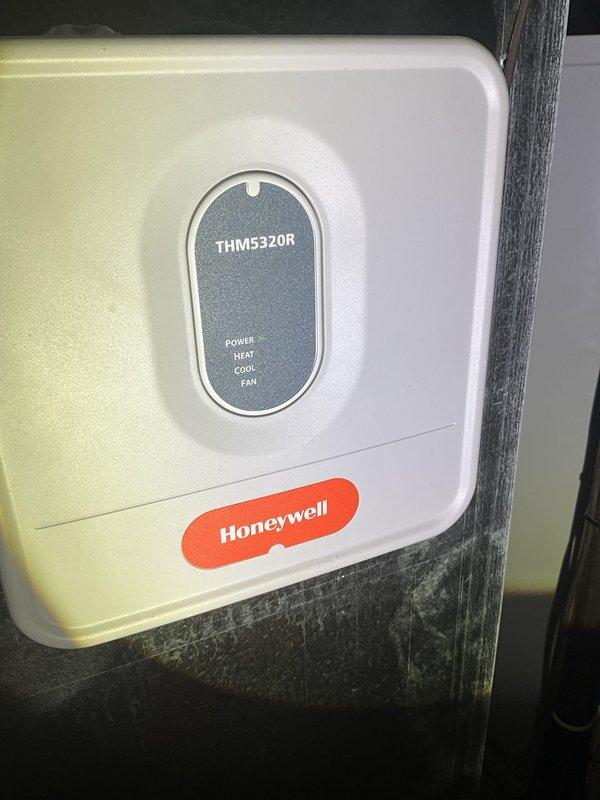 Responded to no cooling complaint for upstairs zone. Upon inspection, found Honeywell THM5320R zoning thermostat disassembled due to physical damage reported by homeowner. Inspected circuit board and housing components; no operational faults found with HVAC system itself. Issue isolated to broken thermostat requiring replacement to restore upstairs zone control.