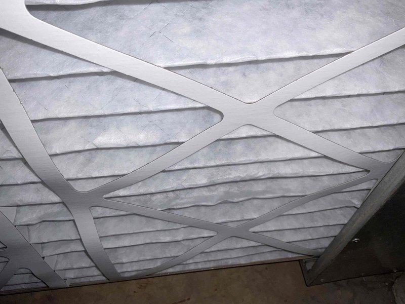 Completed comprehensive BFMA tune-up service on residential air conditioning system. Performed standard maintenance protocol including inspection of outdoor condenser unit, which showed normal weathering and minor debris accumulation on pad that was addressed. Inspected and documented condition of air filter, which displayed moderate dust and particulate buildup consistent with regular usage. All system components evaluated and unit operating within normal parameters upon completion of tune-up service.