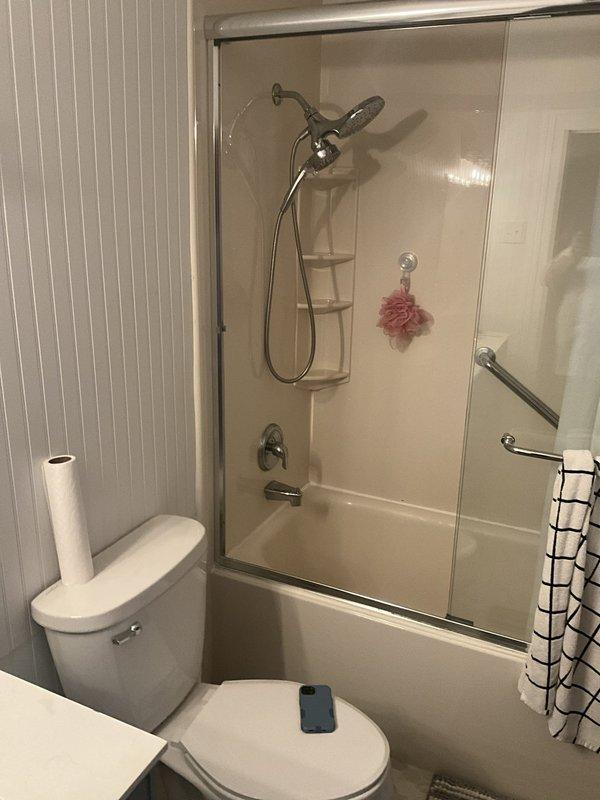 Shut off main water supply to residence and systematically drained entire plumbing system in preparation for shower/tub fixture service. Utilized pipe wrench and hand tools to access shut-off valves and ensure complete water evacuation from supply lines, preventing water damage during repair work.