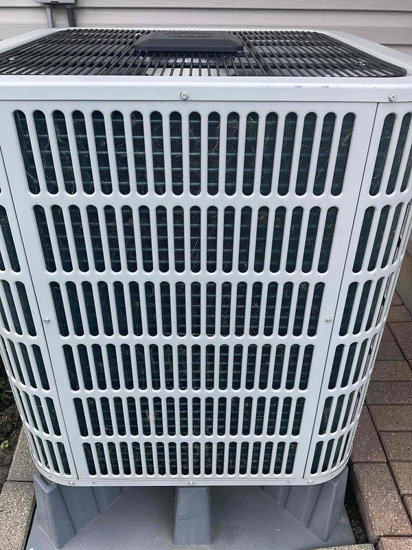 Completed comprehensive BFMA tune-up service on residential outdoor air conditioning condenser unit. Performed standard maintenance protocol including inspection of electrical components, conduit connections, and disconnect box; verified proper unit placement on risers and concrete pad; cleaned condenser coils and checked fan operation; tested system performance and airflow through vertical slat grille assembly. Unit operating within normal parameters with no issues identified; equipment is in good working condition for continued seasonal operation.