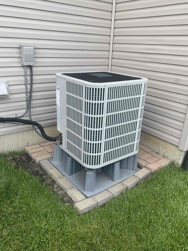 Completed comprehensive BFMA tune-up service on residential outdoor air conditioning condenser unit. Performed standard maintenance protocol including inspection of electrical components, conduit connections, and disconnect box; verified proper unit placement on risers and concrete pad; cleaned condenser coils and checked fan operation; tested system performance and airflow through vertical slat grille assembly. Unit operating within normal parameters with no issues identified; equipment is in good working condition for continued seasonal operation.