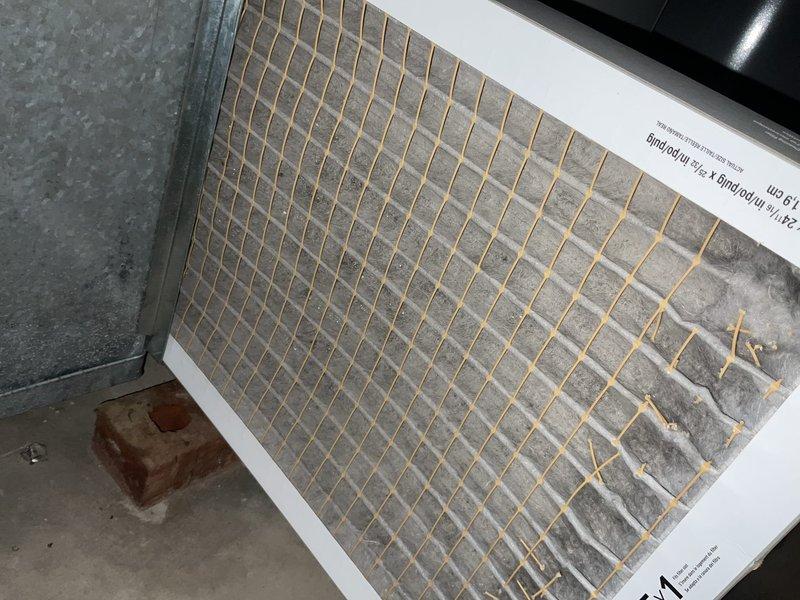 Completed comprehensive BFMA tune-up service on residential air conditioning system over 5 years old. Performed standard maintenance procedures including system inspection, filter evaluation, and equipment assessment. Documented existing filter condition showing dust accumulation and inspected copper refrigerant lines, flexible ductwork, and air handler components in attic installation space, noting age-related surface oxidation on copper piping and minor discoloration on ductwork surfaces.