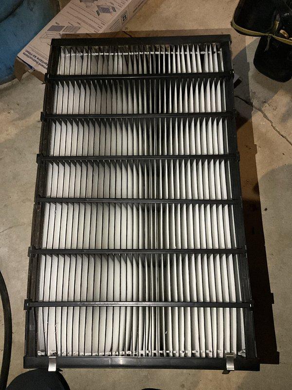 Completed comprehensive BFMA air conditioning tune-up on 9-year-old system, including inspection of outdoor condenser unit and replacement of air filter. Condenser coils showed moderate accumulation of dirt and debris but unit operational; all mechanical components functioning properly with refrigerant lines and electrical connections secure.