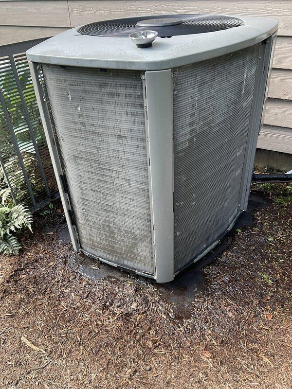 Completed comprehensive BFMA tune-up service on residential Lennox outdoor air conditioning condenser unit. Performed standard maintenance protocol including visual inspection of unit components, verified proper airflow through mesh panels, checked fan operation and grille assembly, and inspected electrical disconnect box mounted on exterior wall. Unit found in operational condition with normal weathering and dirt accumulation on protective mesh panels consistent with outdoor exposure; all components functioning within normal parameters.