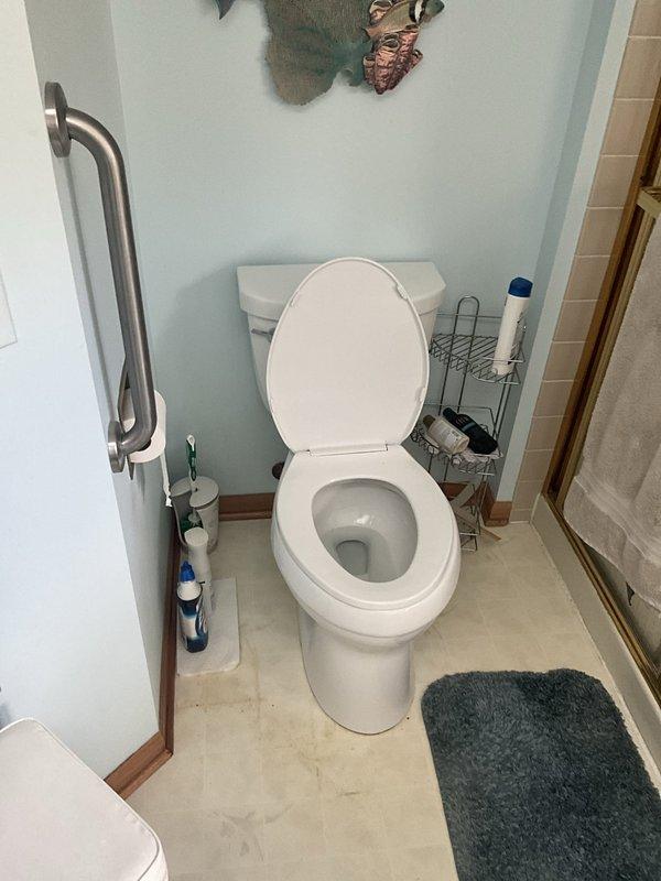 Responded to service call for toilet and sump pump issues at residential property. Inspected toilet tank components and verified proper operation of flush valve, flapper mechanism, and fill valve assembly. All internal toilet mechanisms found to be functioning correctly with no leaks detected. Completed accessibility assessment of bathroom fixtures including grab bar installation and clearances around toilet area.