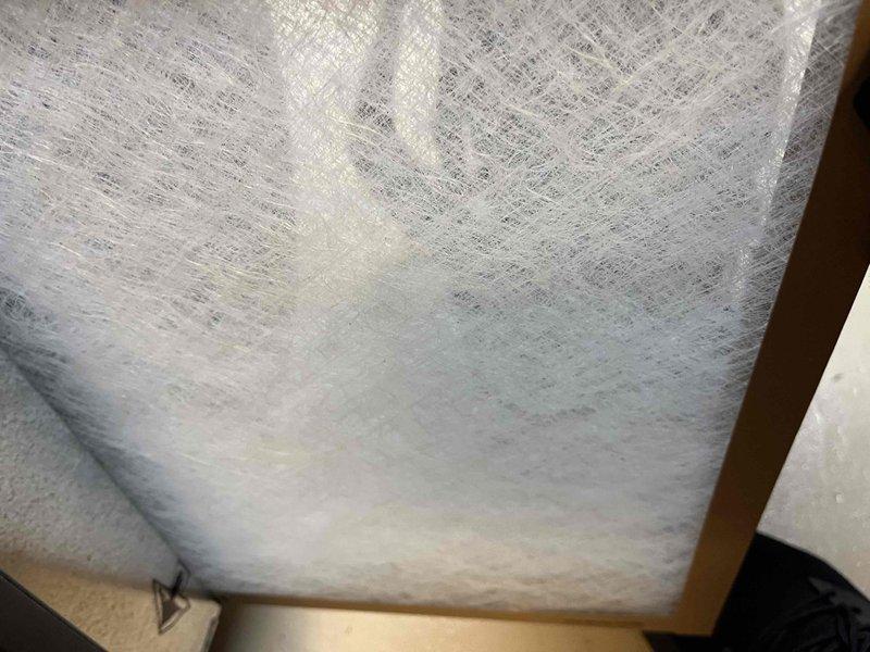 Completed comprehensive BFMA tune-up on a 7+ year old air conditioning system. Inspected indoor air filter showing moderate dust accumulation and discoloration, indicating normal usage since last service. Examined outdoor condenser unit, verifying proper clearance, inspecting coil fins and protective grille for debris and environmental wear, with all components functioning within normal parameters.