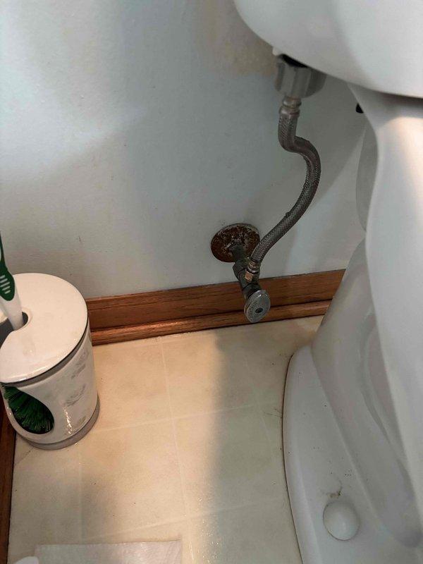 Responded to service call for master bathroom toilet requiring internal component replacement. Upon inspection, identified worn fill valve assembly and deteriorating flush valve components causing inefficient water flow and potential running water issues. Removed existing fill valve mechanism and flush ring assembly from toilet tank. Installed new fill valve with improved water flow regulation and installed new flush ring assembly with updated flapper mechanism to ensure proper seal and water conservation. Replaced corroded flexible water supply line connecting wall shut-off valve to toilet tank inlet with new braided stainless steel supply line, providing improved durability and leak resistance. Tested all connections for proper seal integrity and verified no water leaks at supply line connections or internal tank components. Cycled flush mechanism multiple times to confirm proper fill valve operation, appropriate water level setting, and complete flapper seal engagement. Adjusted fil