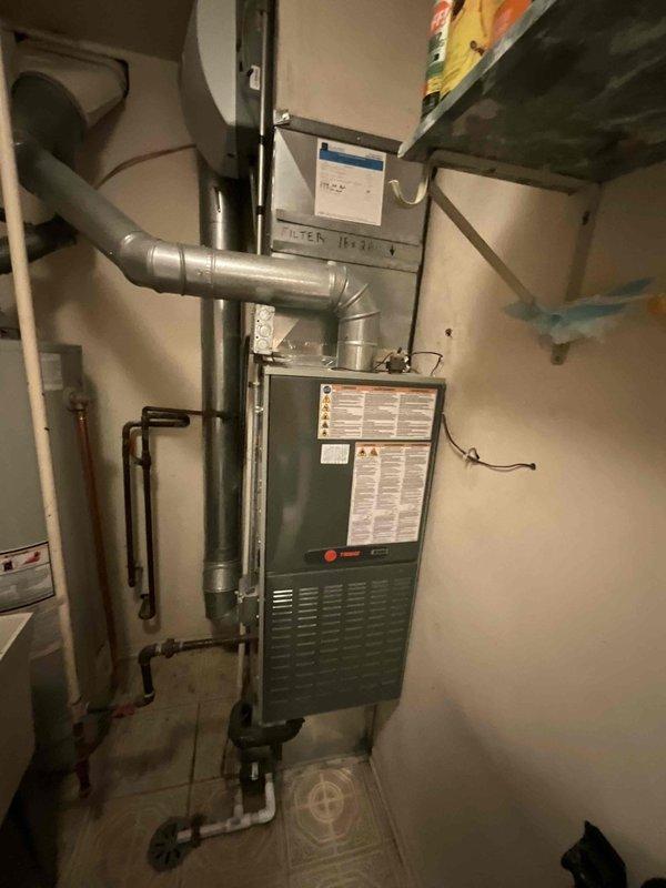 Completed comprehensive BFMA tune-up service on residential HVAC system including outdoor condenser unit and indoor furnace. Performed thorough inspection of 5+ year old equipment, cleaned condenser coil which showed significant accumulation of dust, dirt, and debris on fins, verified refrigerant line connections and electrical components, checked furnace operation and confirmed proper air filter size (16x25x4), inspected ductwork connections, and tested overall system performance to ensure optimal efficiency and reliability for the cooling season.