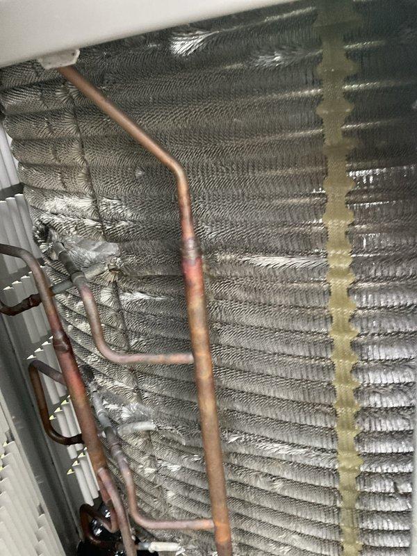 Completed comprehensive BFMA tune-up on American Standard split system air conditioning unit (4+ years old). Performed complete inspection of outdoor condensing unit and indoor evaporator coil assembly located in attic space, verified proper operation of compressor and condenser fan motor, checked refrigerant lines for leaks and proper insulation, inspected aluminum fin condition on both coil assemblies, tested electrical connections at disconnect box, and confirmed system functionality. All components found operating within normal parameters with no immediate service needs identified.