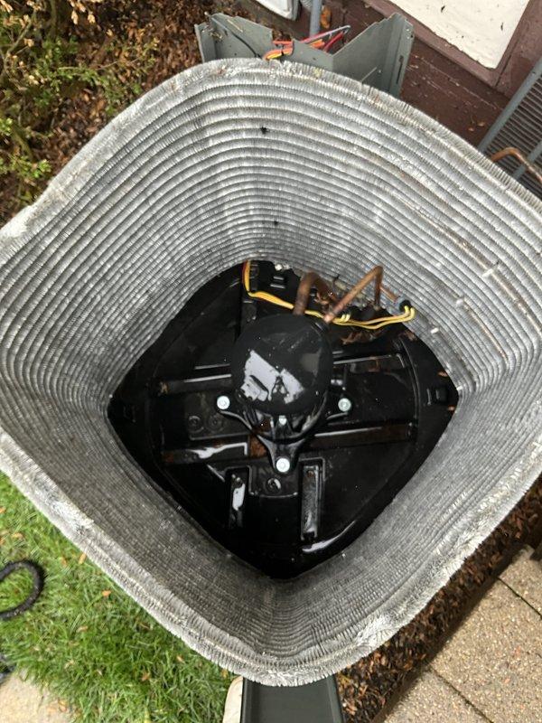 Completed comprehensive BFMA tune-up service on residential air conditioning system with equipment age of 4+ years. Performed full system inspection including outdoor condenser unit evaluation, verified proper refrigerant line connections, inspected coil condition and fin integrity, and confirmed fan motor operation. Interior inspection included smart thermostat functionality check, which was operating properly and maintaining cooling setpoint at 71 degrees. All system components found to be in operational condition with normal outdoor weathering present on condenser unit.