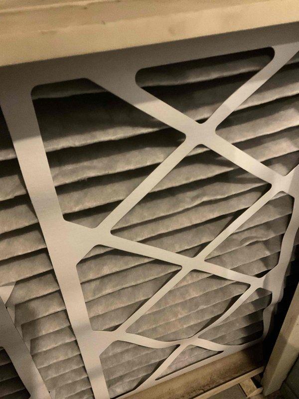 Completed comprehensive air conditioning tune-up on outdoor condenser unit, including system inspection, performance testing, and filter evaluation. Unit found in normal operating condition with standard weathering; all components functioning properly and system ready for continued seasonal use.