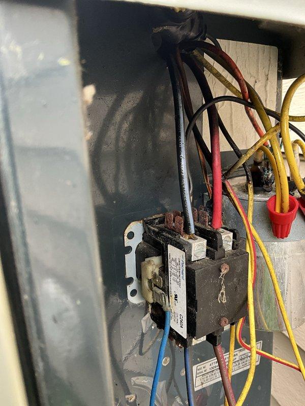 Responded to callback for air conditioning unit experiencing short cycling, excessive noise, and inability to cool. Upon inspection, discovered extensive accumulation of grass clippings, leaves, and organic debris inside the unit's electrical compartment, along with heavily corroded contactor and deteriorated electrical connections. Removed all debris from interior compartment, cleaned affected areas, and assessed electrical components. Found significant corrosion on contactor relay and oxidized terminal connections indicating moisture intrusion and age-related deterioration. Documented conditions with photos and discussed system condition with customer, including recommendation for replacement options given the extent of component deterioration and repeated service issues.