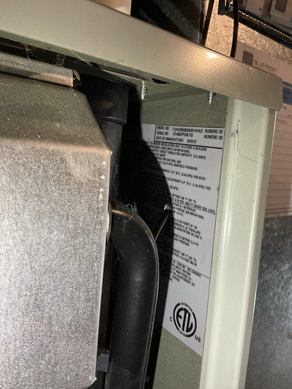 Completed comprehensive HVAC system evaluation for full system replacement estimate in residential basement utility area. Documented existing furnace, water heater, and ductwork configuration including current equipment specifications, installation layout, and spatial requirements for proposed system upgrade.