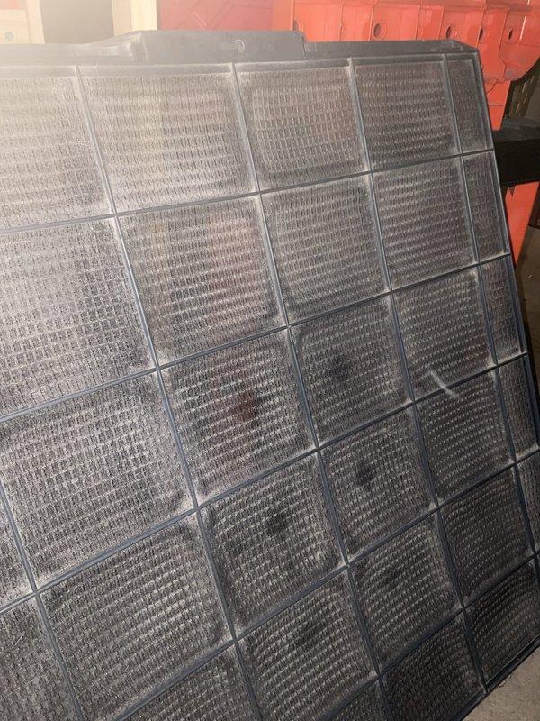 Completed comprehensive BFMA tune-up service on 12+ year old residential air conditioning system during morning appointment window. Performed standard AC maintenance protocol including system inspection, filter evaluation, and condenser unit assessment. Upon inspection, documented heavily soiled outdoor condenser coil with significant dirt and debris accumulation between fins, restricting airflow and reducing heat transfer efficiency. Indoor air filter showed moderate dust and particulate buildup across mesh sections. Evaluated system components, checked electrical connections at disconnect box, and assessed overall unit operation. Documented equipment condition through photographic records for maintenance history. System operational upon completion of tune-up service.