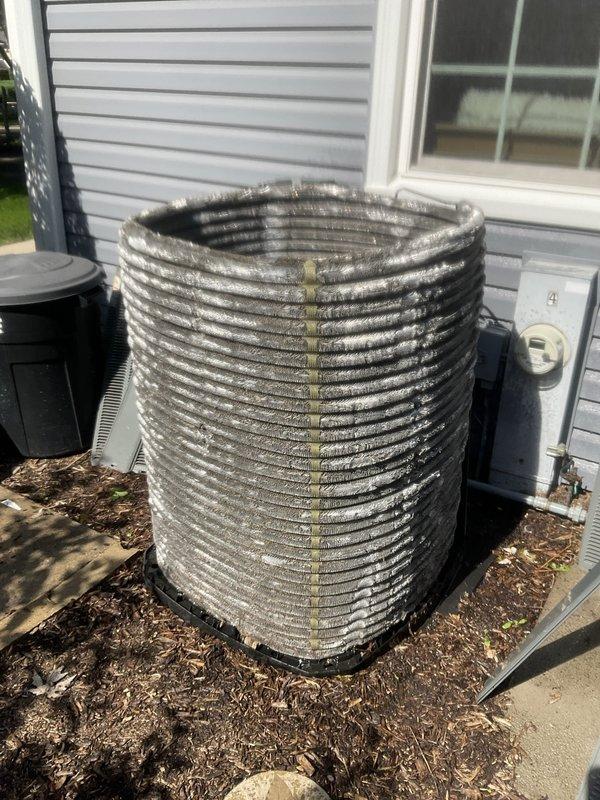 Completed comprehensive BFMA tune-up service on 12+ year old residential air conditioning system during morning appointment window. Performed standard AC maintenance protocol including system inspection, filter evaluation, and condenser unit assessment. Upon inspection, documented heavily soiled outdoor condenser coil with significant dirt and debris accumulation between fins, restricting airflow and reducing heat transfer efficiency. Indoor air filter showed moderate dust and particulate buildup across mesh sections. Evaluated system components, checked electrical connections at disconnect box, and assessed overall unit operation. Documented equipment condition through photographic records for maintenance history. System operational upon completion of tune-up service.
