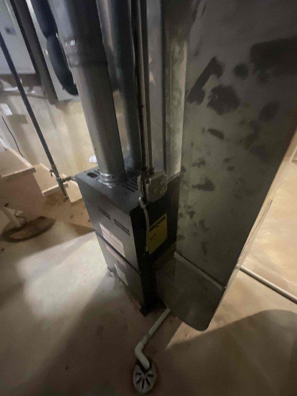 Responded to no cooling call for upstairs unit with water leak from basement pipe. Upon arrival, found 17+ year old system with air handler shut down and only fan operational. Inspected HVAC equipment in basement, identified condensate drain line issue causing water leakage. Evaluated overall system condition noting age of equipment and recommended appropriate repair options to restore cooling operation.