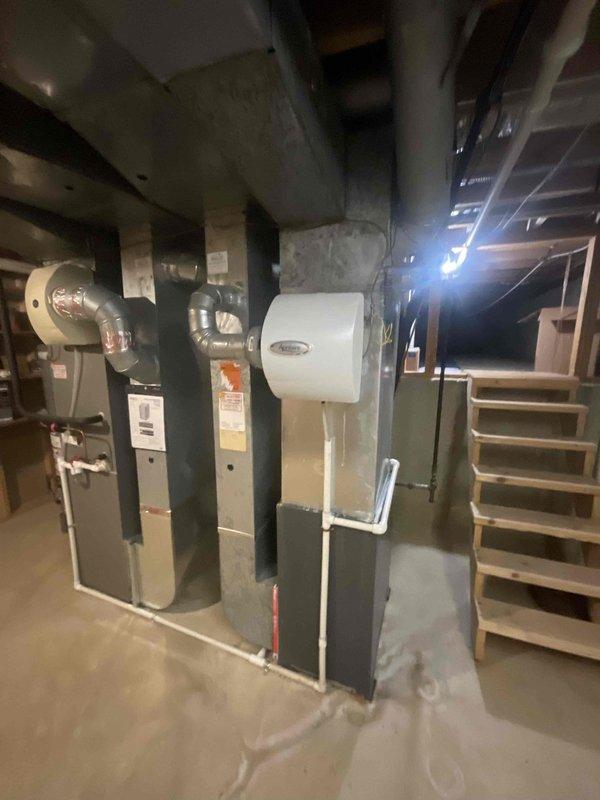Responded to no cooling call for upstairs unit with water leak from basement pipe. Upon arrival, found 17+ year old system with air handler shut down and only fan operational. Inspected HVAC equipment in basement, identified condensate drain line issue causing water leakage. Evaluated overall system condition noting age of equipment and recommended appropriate repair options to restore cooling operation.