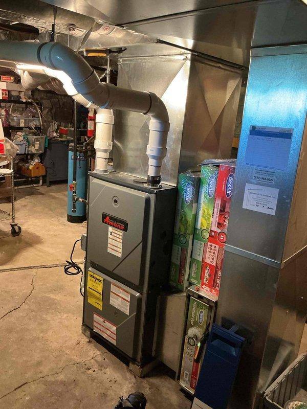 Completed comprehensive BFMA tune-up service on residential HVAC system, including full AC maintenance protocol. Performed electrical diagnostics using clamp meter, tested capacitor functionality with readings at 11.67 microfarads to verify proper operation, and inspected furnace unit with connected ductwork in basement mechanical room. Verified air filtration system components, confirmed all electrical connections secure, and ensured equipment operating within manufacturer specifications for optimal performance.