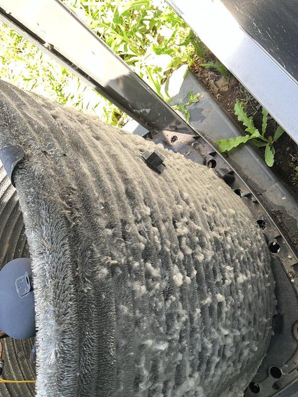 Completed comprehensive BFMA preventive maintenance tune-up on residential air conditioning system. Performed full system inspection of outdoor condenser unit, noting significant accumulation of dirt, dust, and debris on aluminum coil fins restricting airflow. Cleaned condenser coils to restore proper heat transfer efficiency, inspected refrigerant lines showing minor oxidation from weather exposure, verified electrical connections, and assessed overall unit operation. System is approximately 3 years old and functioning properly following maintenance service.