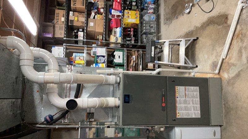 Completed installation of Trane 17 SEER 2-stage air conditioning system including 5TTX7048 outdoor condensing unit and 5PXCC007AS3HA evaporator coil in basement mechanical room. Installed new 50-amp 2-pole Square D QO circuit breaker to meet electrical requirements for the equipment. Reinstalled existing thermostat, connected refrigerant lines, completed PVC condensate drainage system with proper pitch and trap configuration, performed system startup, verified proper operation of both stages, and confirmed all electrical connections meet code requirements.