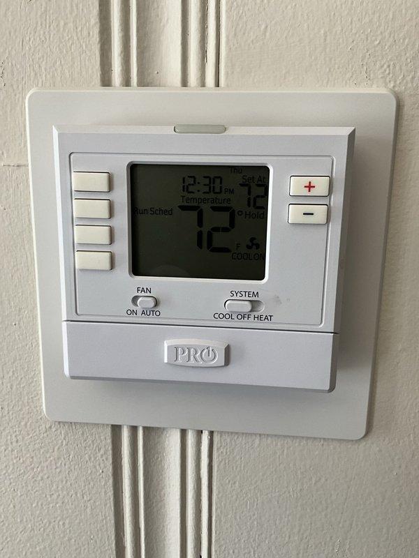 Performed comprehensive BFMA tune-up on residential air conditioning system. Inspected thermostat operation and confirmed proper temperature control settings at 72°F with system functioning in cooling mode. Conducted outdoor condensing unit maintenance, which included removing accumulated debris, leaves, and organic matter from unit base and around compressor. Inspected condenser coils, refrigerant lines, electrical connections, and capacitor. Verified all components operating within normal parameters upon completion of preventive maintenance service.
