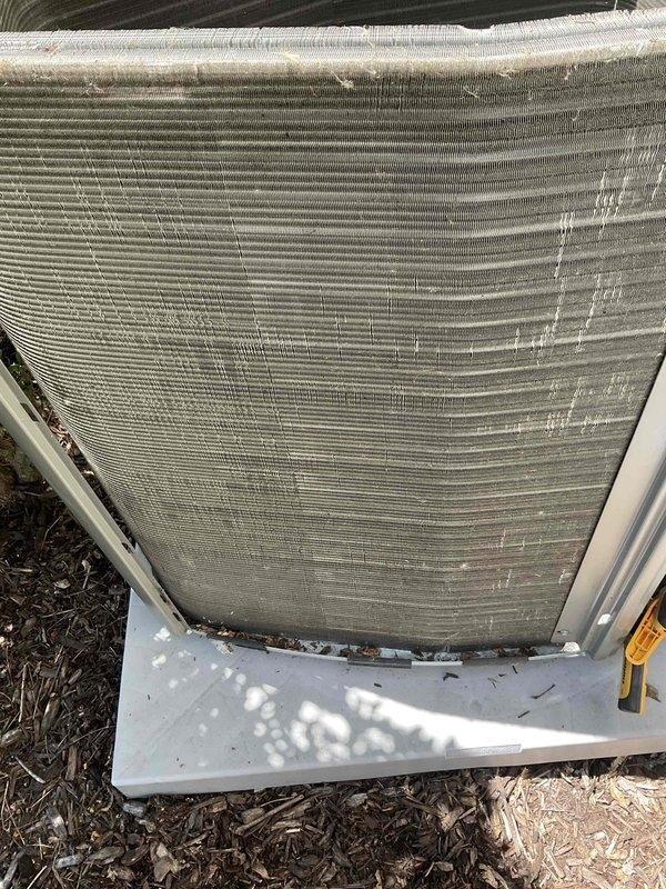 Completed comprehensive BFMA tune-up service on two residential air conditioning systems and dryer vent cleaning. Both AC units, aged 2-5+ years, showed significant accumulation of dirt and debris on condenser coils and fins, restricting airflow and reducing heat transfer efficiency. Performed thorough cleaning of condenser coils, removing heavy buildup of dust, organic matter, and environmental contaminants from aluminum fins and heat exchange surfaces. Inspected internal components including compressor, capacitor, and refrigerant lines; verified proper electrical connections and wiring integrity. Checked copper refrigerant line condition and noted minor oxidation consistent with normal outdoor exposure.

For dryer vent cleaning, utilized two-technician approach due to access constraints. Relocated washer and dryer units using moving blankets to protect flooring and facilitate access to rear connections. Accessed rooftop dryer vent termination using 10-foot ladder and climbing multipl