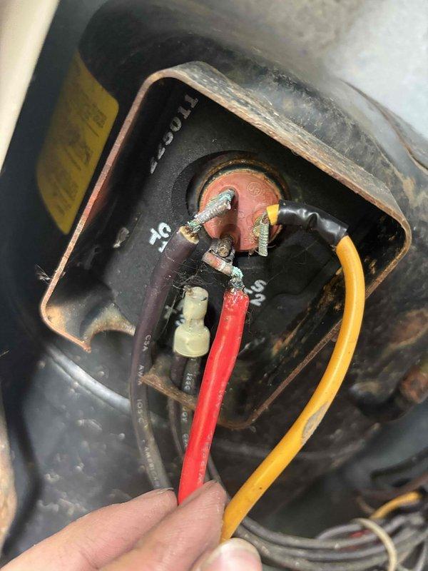 Responded to service call for non-functional air conditioning system. Upon inspection, identified intermittent thermostat connection issue requiring adjustment to establish proper communication with the outdoor unit. Examined electrical connections and wiring terminals, noting signs of age and wear on components within the air handler cabinet. Unit attempted to cycle but experienced connectivity problems between thermostat and condenser. Adjusted thermostat wiring connections to restore proper signal transmission. Assessed system for potential refrigerant deficiency requiring future attention. Unit operational at time of departure with improved thermostat-to-equipment communication.