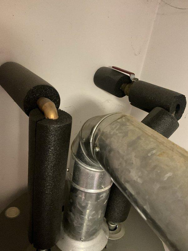 Responded to service call for residential tanked water heater installed in 2020. Upon arrival, conducted thorough inspection of the unit and associated plumbing connections. Examined water heater for proper operation, checked all inlet and outlet piping, inspected pressure relief valve, and verified venting system integrity. Assessed HVAC refrigerant lines and ductwork in adjacent mechanical space for any interference or related issues. All components were photographed for documentation purposes. Unit found to be functioning within normal parameters with no immediate safety concerns identified.