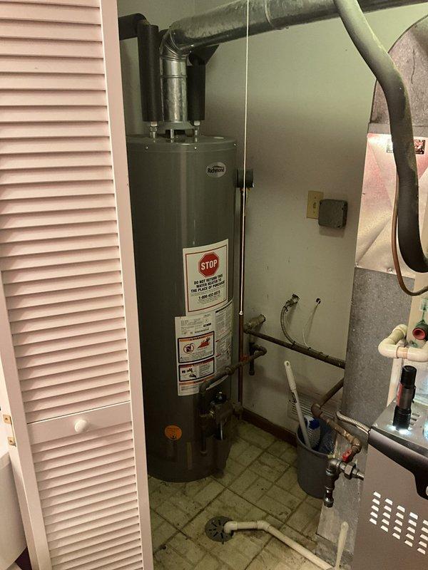 Responded to service call for residential tanked water heater installed in 2020. Upon arrival, conducted thorough inspection of the unit and associated plumbing connections. Examined water heater for proper operation, checked all inlet and outlet piping, inspected pressure relief valve, and verified venting system integrity. Assessed HVAC refrigerant lines and ductwork in adjacent mechanical space for any interference or related issues. All components were photographed for documentation purposes. Unit found to be functioning within normal parameters with no immediate safety concerns identified.