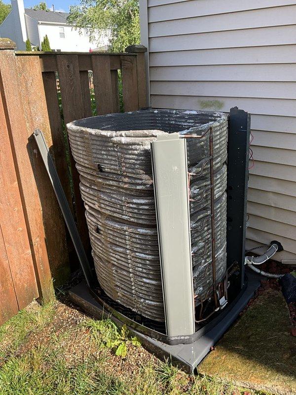 Completed comprehensive BFMA tune-up service on a 7-year-old residential air conditioning system. Performed full inspection of outdoor condenser unit, noting weathered fins with dirt accumulation that were cleaned during service. Verified proper operation of cooling system through Honeywell digital thermostat, confirmed "Cool On" status and proper system response. Inspected refrigerant lines, electrical connections, and mechanical components for proper operation and safety compliance. Unit operating within normal parameters upon completion of preventative maintenance service.