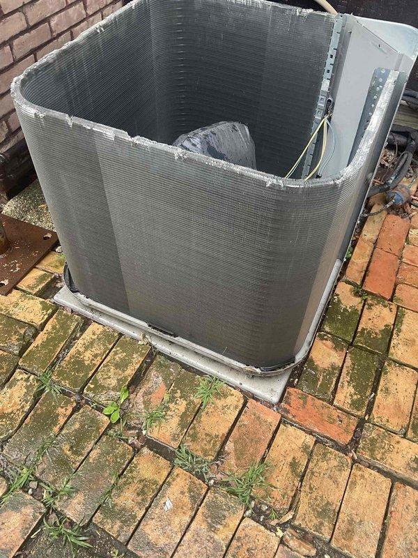 Completed comprehensive BFMA tune-up service on two residential air conditioning systems, both approximately 15 years old. Performed standard preventive maintenance procedures including inspection of outdoor condenser units, which revealed moderate fin damage and deterioration along the top coil sections with accumulated debris throughout the heat exchanger surfaces. Cleaned condenser coils, checked electrical connections and wiring, verified refrigerant levels, tested system operation and performance, and documented equipment condition with photographic evidence showing weathered components and protective mesh screening on exterior units mounted on brick paver patio.