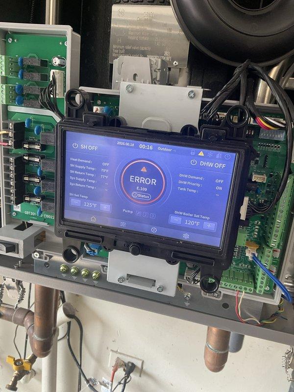 Responded to service call for boiler system displaying error code on digital control panel. Upon inspection, found system in error state with status code 0 showing on touchscreen interface. Diagnosed control board issue affecting driveway heating zone operation. Cleared error code, inspected wiring connections and actuator valves, verified proper system communication between control panel and zone components. Cycled system through operational test, confirmed error resolution and restored normal heating function to driveway radiant heating system.
