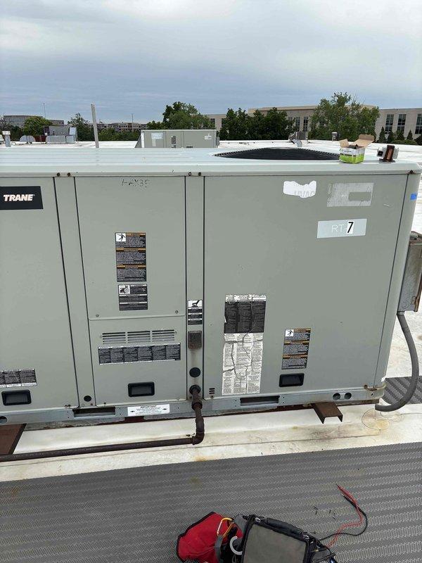 Responded to commercial RTU not maintaining setpoint temperature. Upon arrival, located and inspected Trane rooftop unit #7 which was calling for cooling but space temperature was 4 degrees above setpoint. Performed diagnostic evaluation of unit operation and identified issue preventing proper cooling cycle. Completed necessary repairs to restore unit to normal operation and verified system achieved proper temperature control before departure.