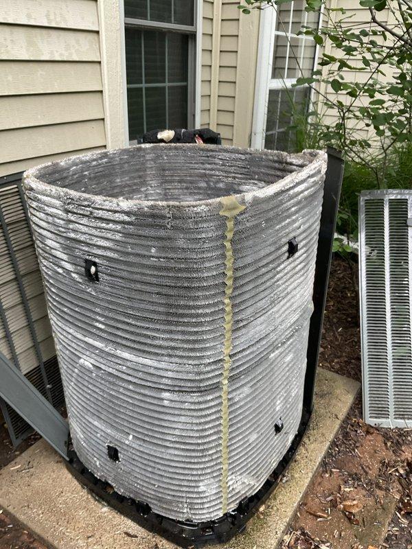Completed comprehensive BFMA tune-up service on a 10+ year old Trane outdoor condensing unit. Performed full system inspection including visual assessment of cabinet condition, verified proper unit mounting and levelness on concrete pad, inspected electrical connections, checked refrigerant lines and insulation integrity, cleaned condenser coils, examined fan motor operation, and documented equipment condition with photographs. Unit operational and functioning within normal parameters upon service completion.