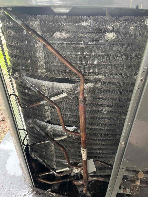 Completed comprehensive BFMA tune-up service on a 5-year-old air conditioning system, arriving after 1PM as requested. Performed thorough inspection of evaporator coil assembly, noting moderate dust and debris accumulation on fin surfaces and between coil rows. Assessed refrigerant lines showing normal oxidation consistent with equipment age, verified all copper connections, and documented unit condition through detailed photography. System components were inspected, cleaned, and confirmed operational within manufacturer specifications.