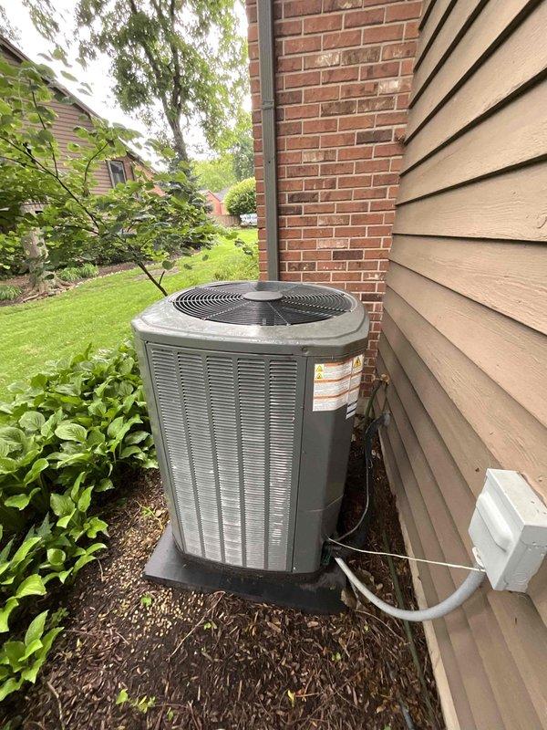 Completed comprehensive BFMA tune-up on 15+ year old outdoor AC condenser unit. Removed accumulated leaves and organic debris from interior of unit that had collected around compressor, fan motor, and refrigerant lines. Performed standard maintenance inspection of all mechanical components, electrical connections, and refrigerant lines; verified unit operation and proper airflow through louvers and top-mounted fan grille.