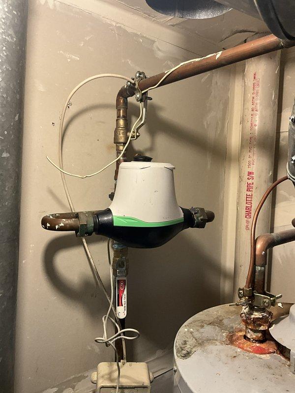 Completed comprehensive plumbing inspection and tune-up maintenance service at residential property. Inspected water heater installation, noting significant corrosion on copper pipe connections at both inlet and outlet ports, deteriorating flue pipe coating with extensive peeling and flaking, and visible rust accumulation at pipe-to-tank junction points. Documented existing conditions including thermal expansion device with dielectric union connections, brass shutoff valves, and overall water heater assembly showing age-related wear. Provided customer with photographic documentation and maintenance recommendations to address corrosion issues and extend equipment lifespan.