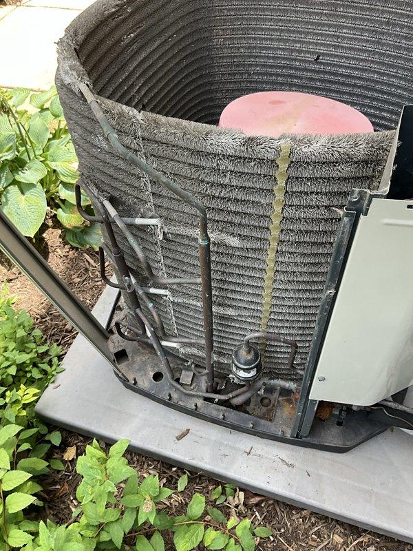 Completed comprehensive BFMA tune-up on 13-year-old air conditioning system during morning service window. Performed thorough inspection of outdoor condenser unit, which showed significant accumulation of dirt, dust, and debris on coil surfaces. Cleaned condenser coils to remove heavy buildup of lint and grime from finned surfaces, inspected evaporator coil for dirt accumulation, checked refrigerant lines and mounting components for proper condition, and verified all structural elements were intact. System operational following maintenance procedures with improved airflow efficiency after coil cleaning.