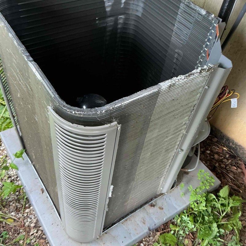 Performed comprehensive BFMA tune-up on 7-year-old residential air conditioning system. Removed condenser top cover for inspection, measured electrical amperage draw at 0.23 amps using clamp meter to verify compressor performance, and inspected refrigerant lines and electrical connections. System operating within normal parameters with all components functioning properly.