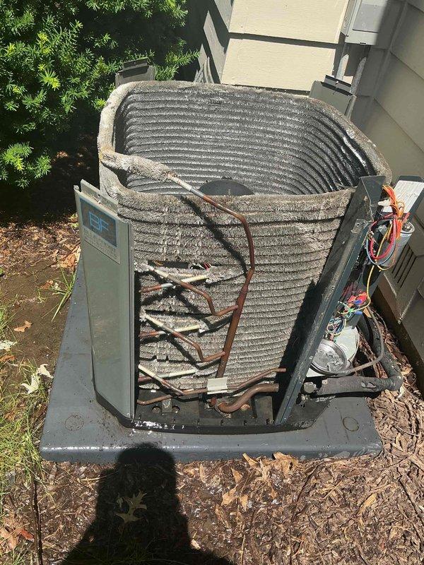 Performed comprehensive BFMA tune-up on 7+ year old residential air conditioning system. Inspected outdoor condenser unit, noting significant dust and debris accumulation on heat exchanger coil fins. Verified refrigerant line connections, service port accessibility, and overall system operation. Unit mounted on concrete pad with proper clearances maintained. Documented equipment condition with photos showing coil contamination requiring future cleaning attention for optimal heat transfer efficiency.