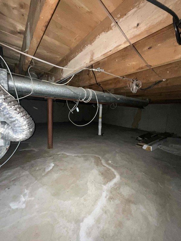 Responded to no cooling call with reported water leakage near evaporator coil area in crawl space. Upon inspection, found air handler unit with associated ductwork and condensate pump installation. Observed moisture issues around evaporator coil section with water not reaching recently installed condensate pump as described. Conducted thorough system evaluation including inspection of drain line routing, condensate pan condition, and insulation coverage on refrigerant lines and ductwork. No trouble found during diagnostic testing - system operating within normal parameters with proper airflow, adequate refrigerant charge, and functional condensate removal system at time of service call.