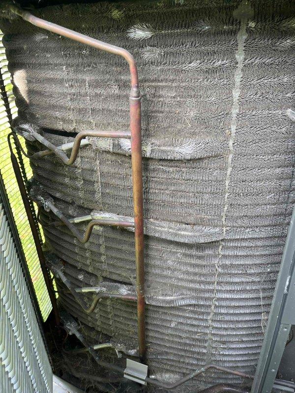 Completed comprehensive BFMA tune-up service on Trane outdoor condensing unit. Performed standard air conditioning maintenance protocol including system inspection, cleaning of evaporator coils which showed significant dust and debris accumulation, and verification of refrigerant lines and copper tubing connections. All components tested and system restored to optimal operating condition.