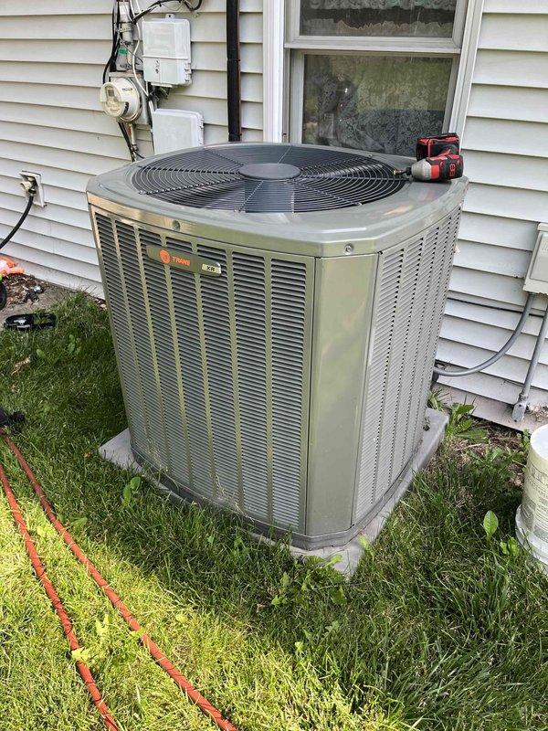 Completed comprehensive BFMA tune-up service on Trane outdoor condensing unit. Performed standard air conditioning maintenance protocol including system inspection, cleaning of evaporator coils which showed significant dust and debris accumulation, and verification of refrigerant lines and copper tubing connections. All components tested and system restored to optimal operating condition.
