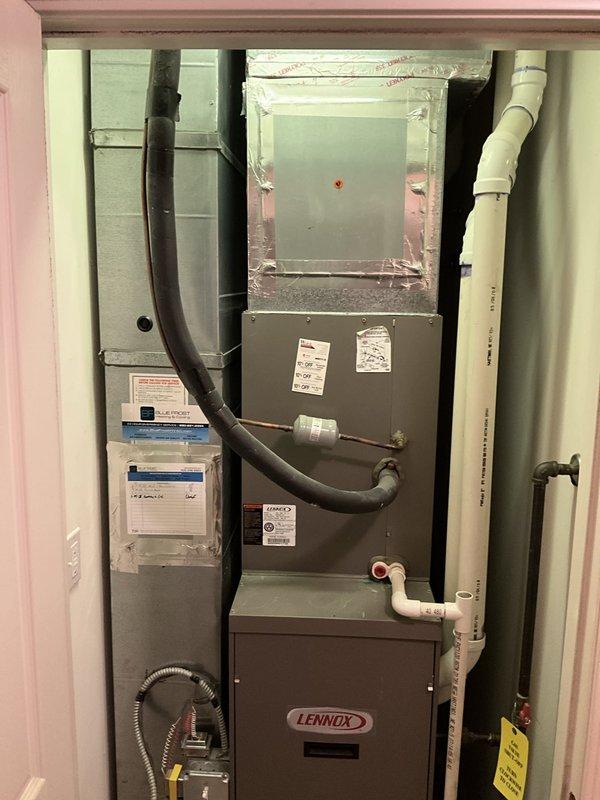 Conducted comprehensive sales estimate for complete air conditioning and evaporator coil replacement system. Evaluated existing residential HVAC installation including Lennox furnace unit, air handler with deteriorating exterior finish, flexible ductwork configuration, and PVC condensate drainage system located in interior utility closet. Assessed electrical service panel with Square D breakers to verify adequate amperage capacity for proposed equipment upgrade. Documented current system layout including concrete block construction considerations, existing duct connections, and mechanical room access constraints. Photographed electrical distribution panel showing circuit breaker configuration and main service disconnect to determine compatibility with new A/C and coil installation requirements.