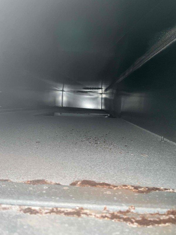 Performed comprehensive duct cleaning service for two HVAC systems at residential property. Removed accumulated dust, debris, and particulate buildup from interior ductwork using professional cleaning equipment. Documented significant condensation issue with approximately five gallons of water backup in PVC condensate drain line. Captured detailed photographs of condensate drainage problem and duct conditions for HVAC technician review and further diagnostic evaluation.