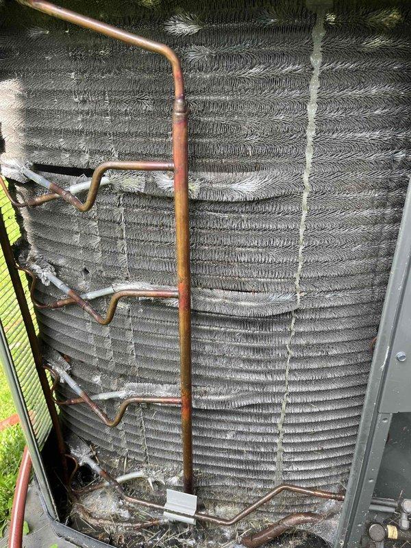 Completed comprehensive BFMA tune-up service on residential air conditioning system over 3 years old during morning appointment window. Performed thorough inspection of evaporator coil assembly, noting multiple horizontal fin rows with minor dust and debris accumulation along edges; copper refrigerant lines showed normal oxidation patterns consistent with equipment age. Inspected and evaluated pleated air filter showing relatively clean condition with minimal dust accumulation; filter media maintained structural integrity with proper reinforcement strips in place. System components operating within normal parameters upon completion of preventive maintenance procedures.