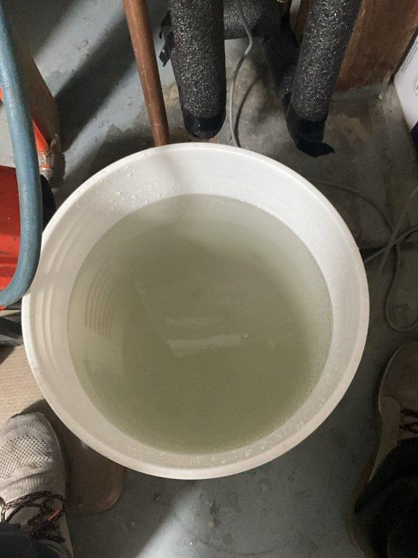 Performed comprehensive tankless water heater maintenance flush on wall-mounted unit in basement mechanical room. Isolated unit from water supply, drained system, and circulated manufacturer-approved descaling solution through heat exchanger to remove mineral buildup and scale deposits. Thoroughly flushed cleaning solution from system, restored water supply to unit and residence, and conducted operational testing to verify proper function and confirm no leaks at connection points.