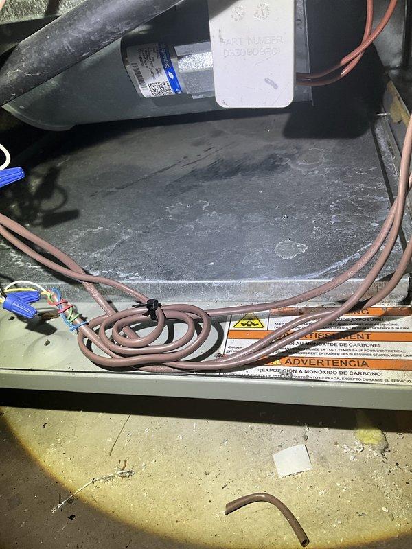 Responded to service call for furnace inspection following water damage incident. Performed diagnostic evaluation on Heil 7000 series furnace unit to assess operational status and determine extent of water-related damage for insurance documentation purposes. Conducted thorough visual inspection of internal components, including blower assembly, control board, wiring connections, and burner compartment. Documented current condition of unit with photographic evidence showing dust accumulation, exposed mechanical components, and overall system configuration. Inspected PVC condensate drainage lines and surrounding ductwork for signs of water intrusion or moisture damage that could affect system performance or safety.