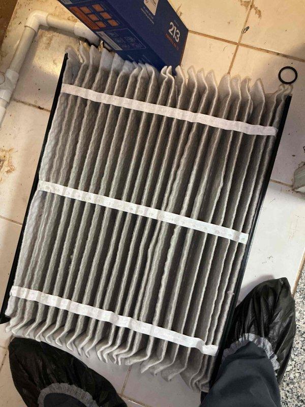 Completed comprehensive BFMA tune-up service on two air conditioning systems, including inspection of garage mini-split unit. Performed filter replacement on heavily soiled air filter showing significant dust and debris accumulation. Conducted thorough maintenance on outdoor condenser unit, addressing substantial dirt and debris buildup on coil fins that was restricting airflow and reducing system efficiency. Cleaned condenser coils, inspected refrigerant lines, verified electrical connections at disconnect box, and ensured proper system operation. All equipment tested and operating within normal parameters upon completion of semi-annual maintenance service.