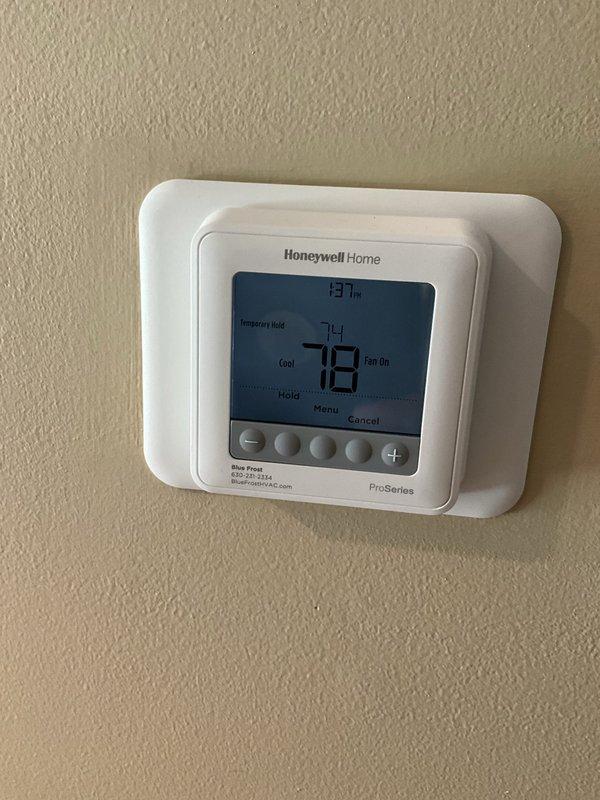 Completed comprehensive BFMA AC tune-up on 9-year-old cooling system. Performed standard maintenance protocol including inspection of Honeywell Home ProSeries thermostat confirming proper operation in cooling mode at 78°F setpoint, evaluated outdoor condenser unit noting weathered aluminum fins with dust accumulation and fan assembly showing age-related corrosion on blades and motor housing. System operational upon completion of preventive maintenance service.